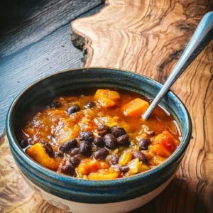 A bowl of sweet potato and black bean soup