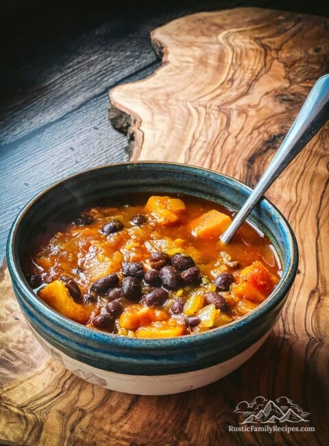A bowl of sweet potato and black bean soup