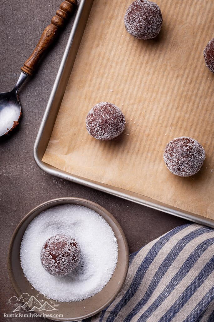 Cookie dough balls on a baking sheet ready to bake