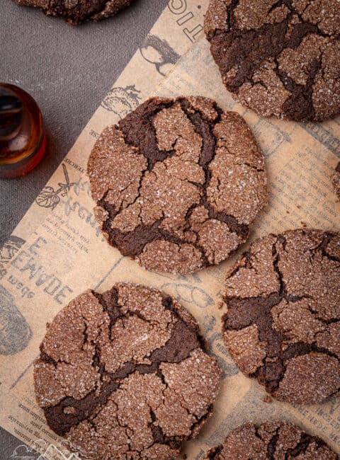 Chocolate sugar cookies cooling on parchment paper