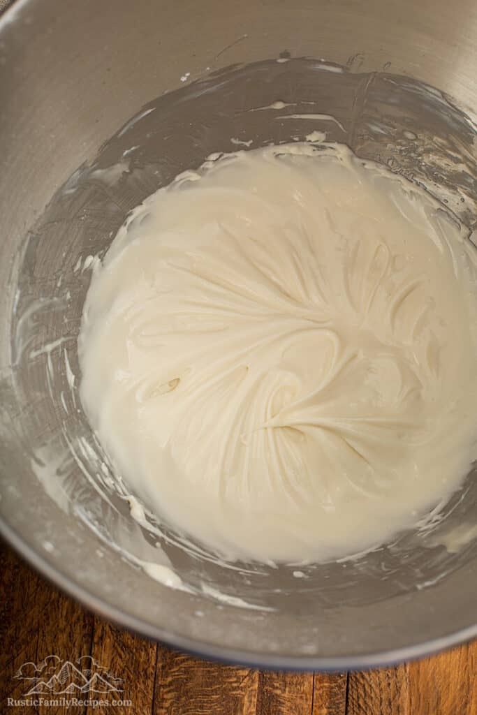Cinnamon bun icing in a stand mixer bowl
