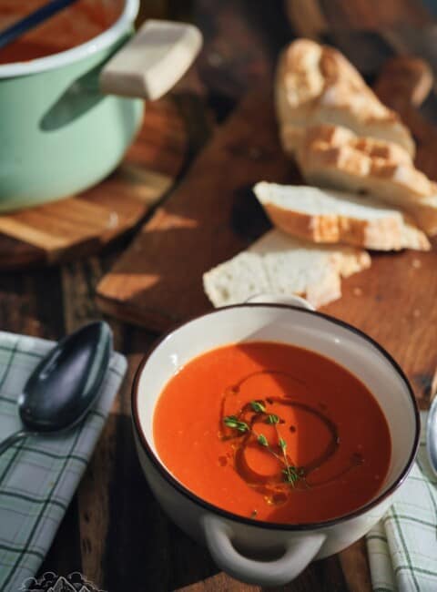 Bowl of tomato soup with olive oil.