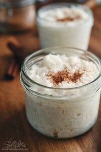 Rice pudding in mason jars topped with cinnamon