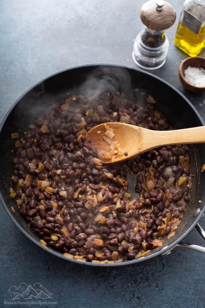 Black beans in a frying pan.