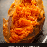 A baked sweet potato cut open next to a fork