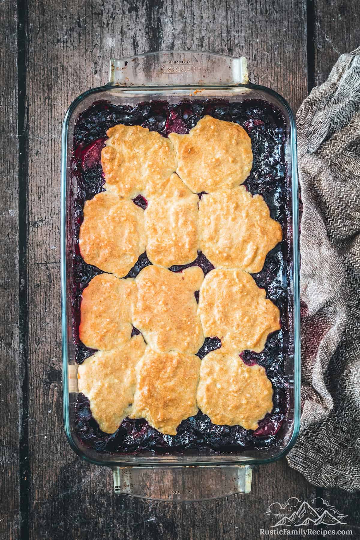 Blueberry peach cobbler in a glass baking pan