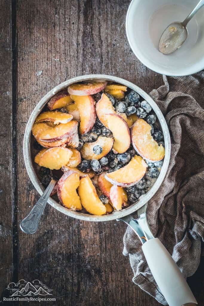 Fresh blueberries and peaches tossed with sugar and flour