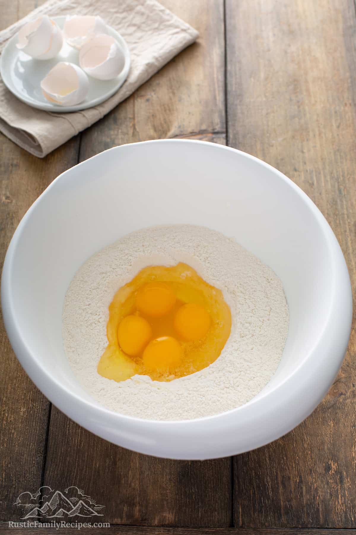 Eggs in the center of dry pancake ingredients