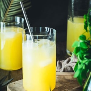 Three glasses of mango lemonade with ice