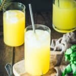 Three glasses of mango lemonade with ice