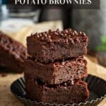 Three vegan sweet potato brownies stacked on a plate