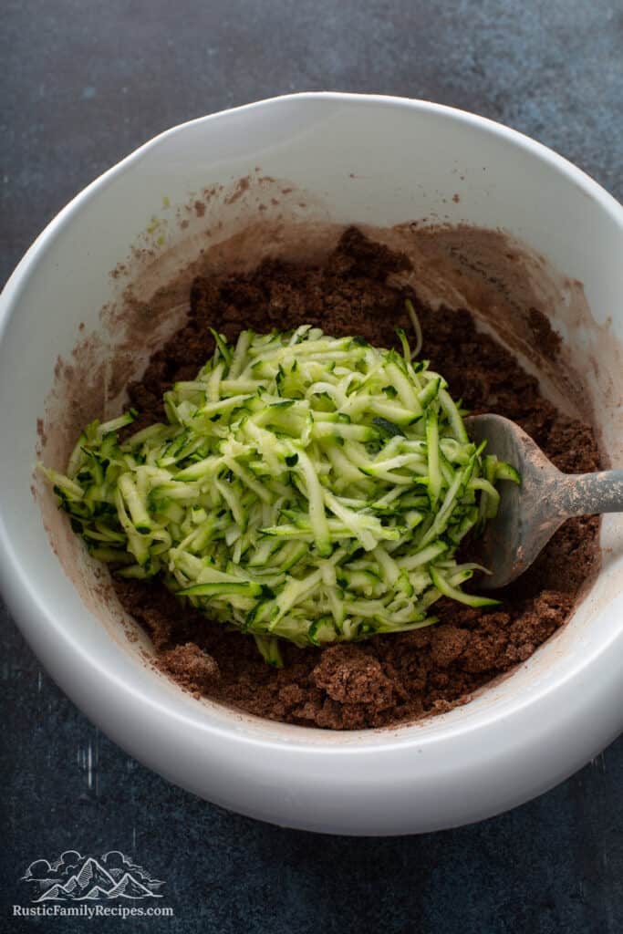 Grated zucchini on top of brownie batter
