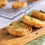 Fried green tomatoes on a wood cutting board