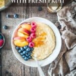 A bowl of millet porridge topped with fresh fruit