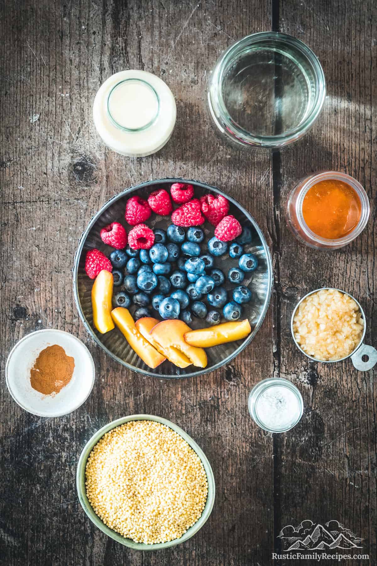Ingredients for millet porridge with fresh fruit: milk, water, agave, cooked millet, salt, raw millet grains, ground cinnamon, with chopped fresh fruit and berries.
