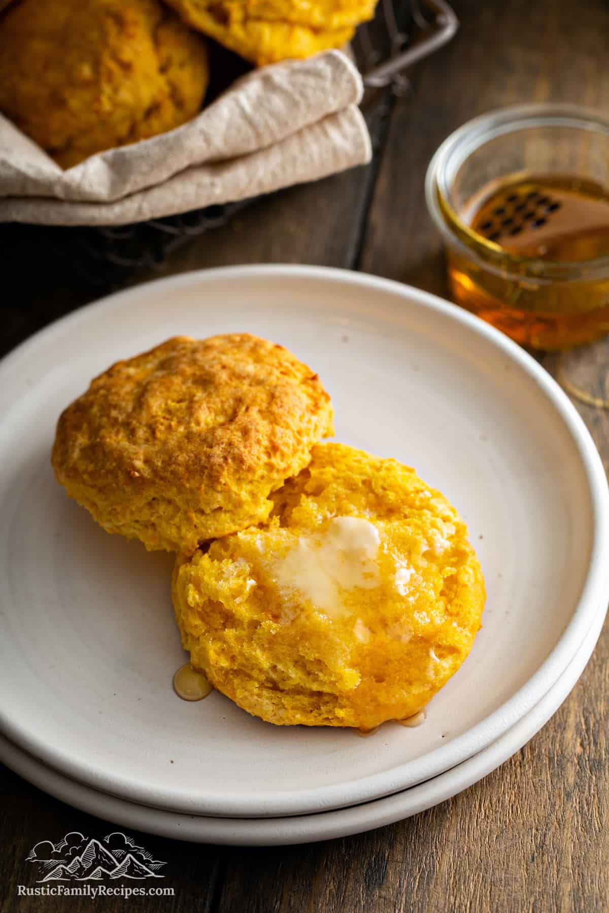 Sweet Potato Buttermilk Biscuit cut in half, topped with melted butter