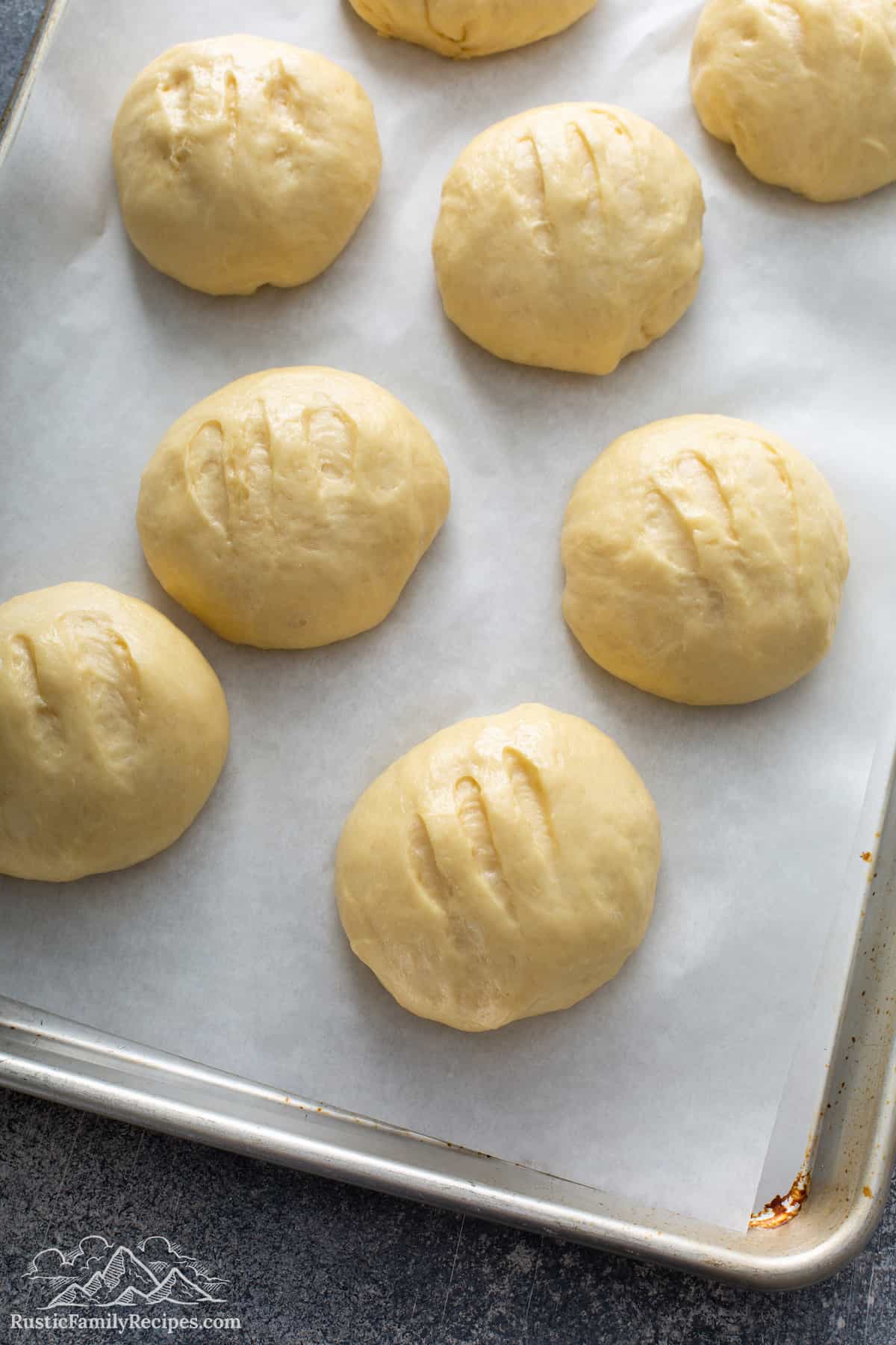 Pan dulce on parchment-lined baking sheet before baking