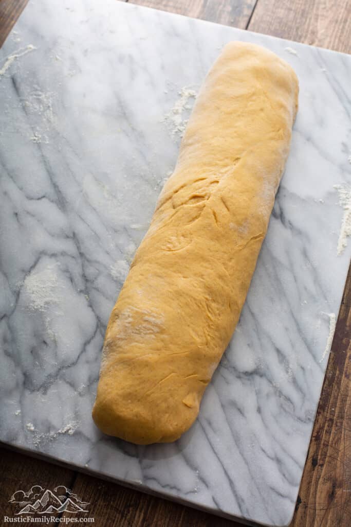 Pumpkin Apple Apricot Bread dough on floured marble baking slab
