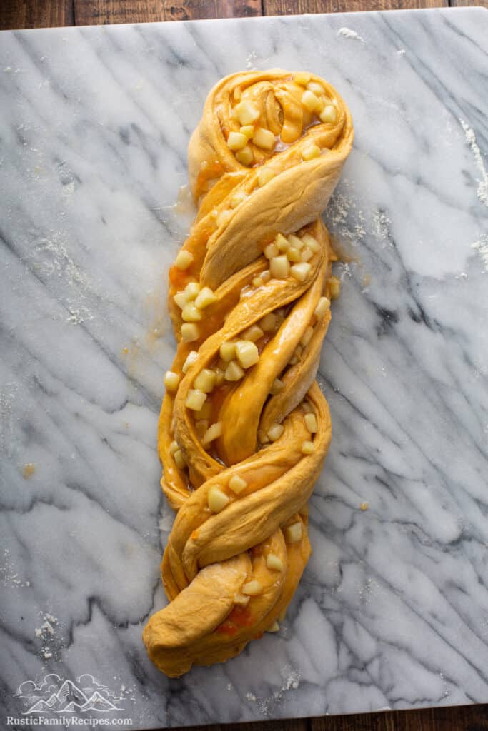 Pumpkin Apple Apricot Bread dough on marble baking slab
