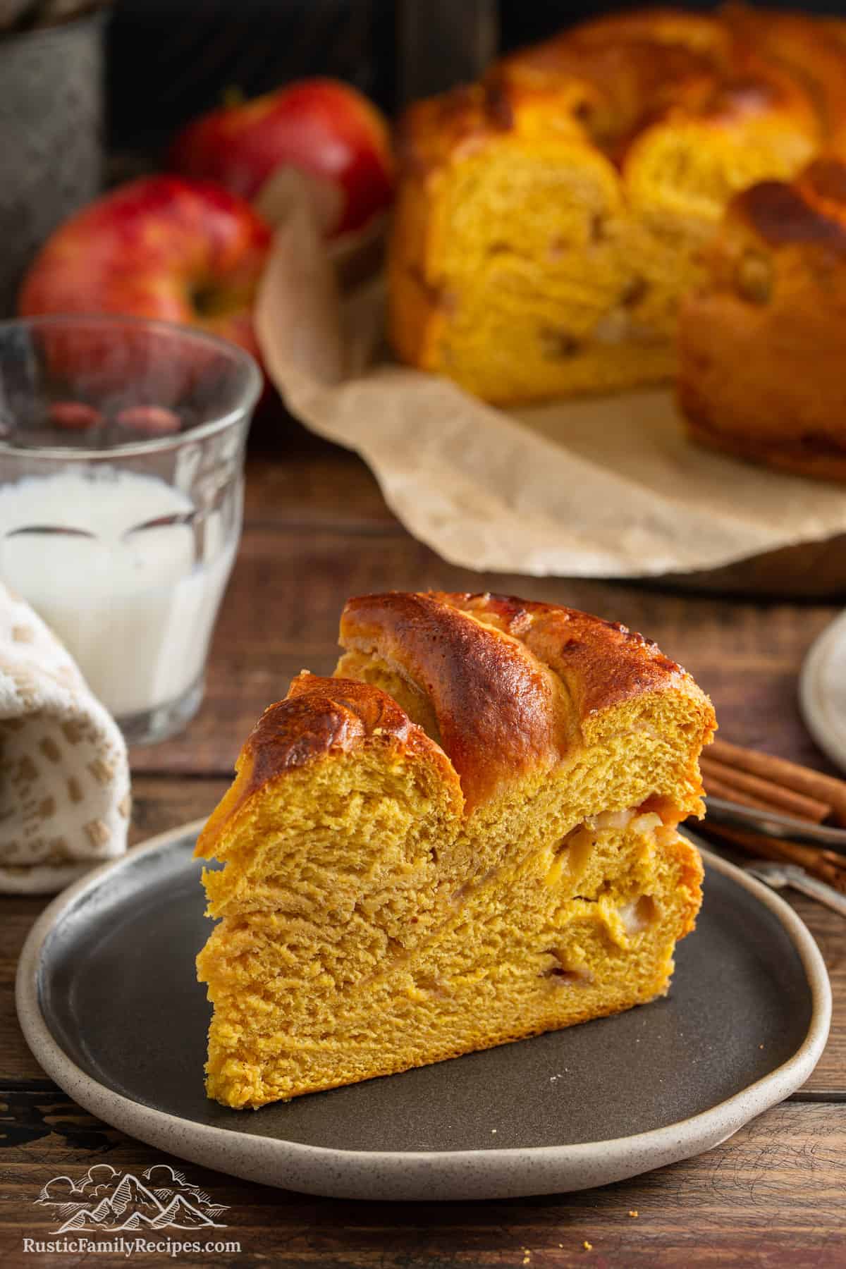 Slice of Pumpkin Apple Apricot Bread on rustic gray plate