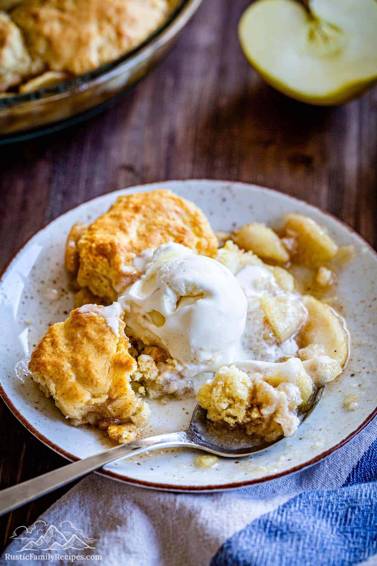 Apple cobbler on a plate with ice cream