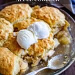 Apple cobbler in a pie pan with ice cream