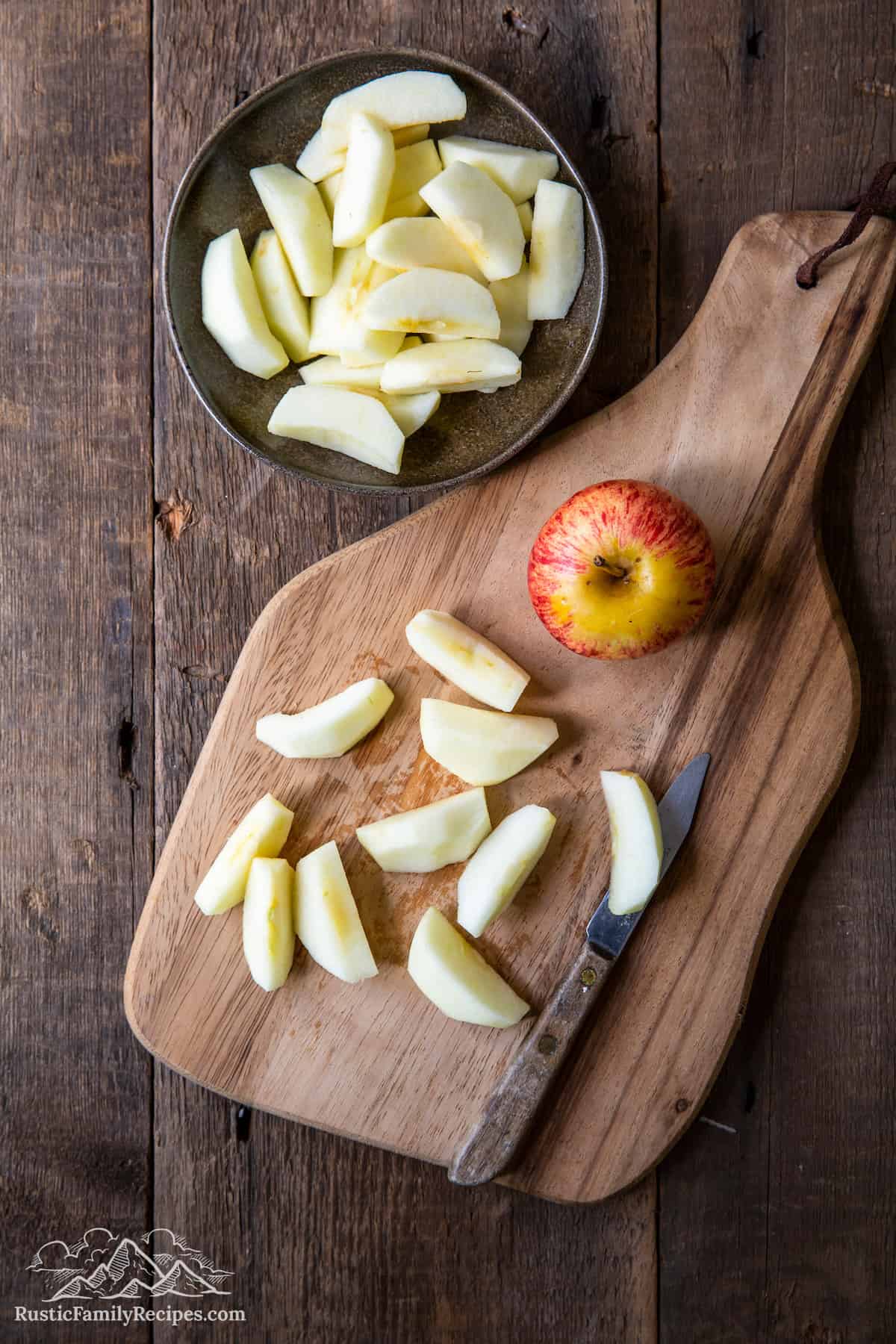 Overhead shot of apple slices on cutting board