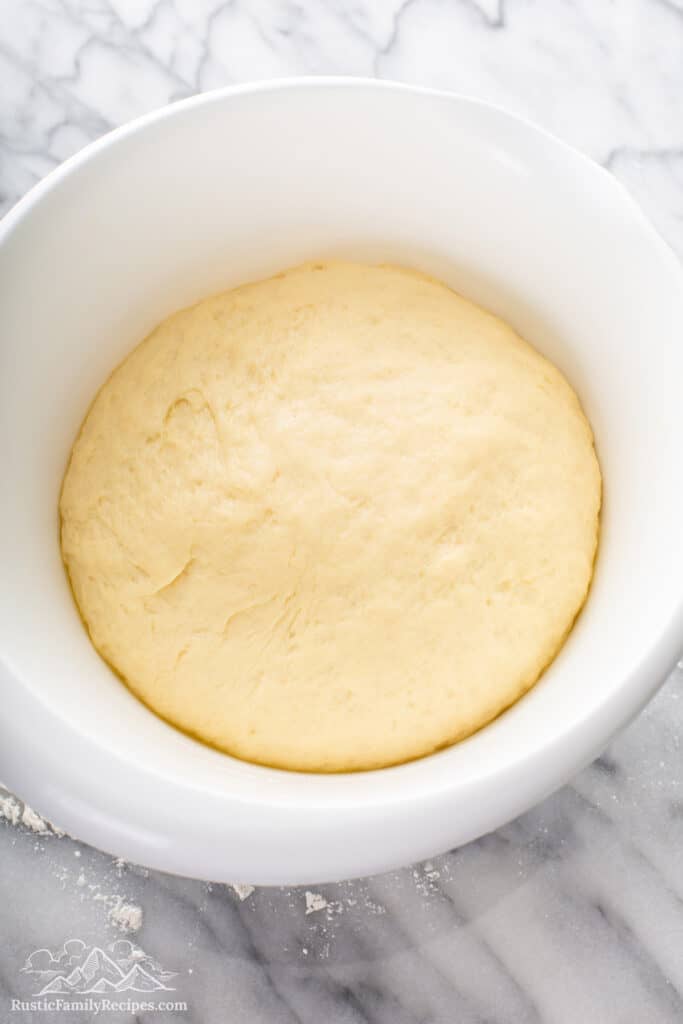 Honey Vanilla Challah dough in white bowl