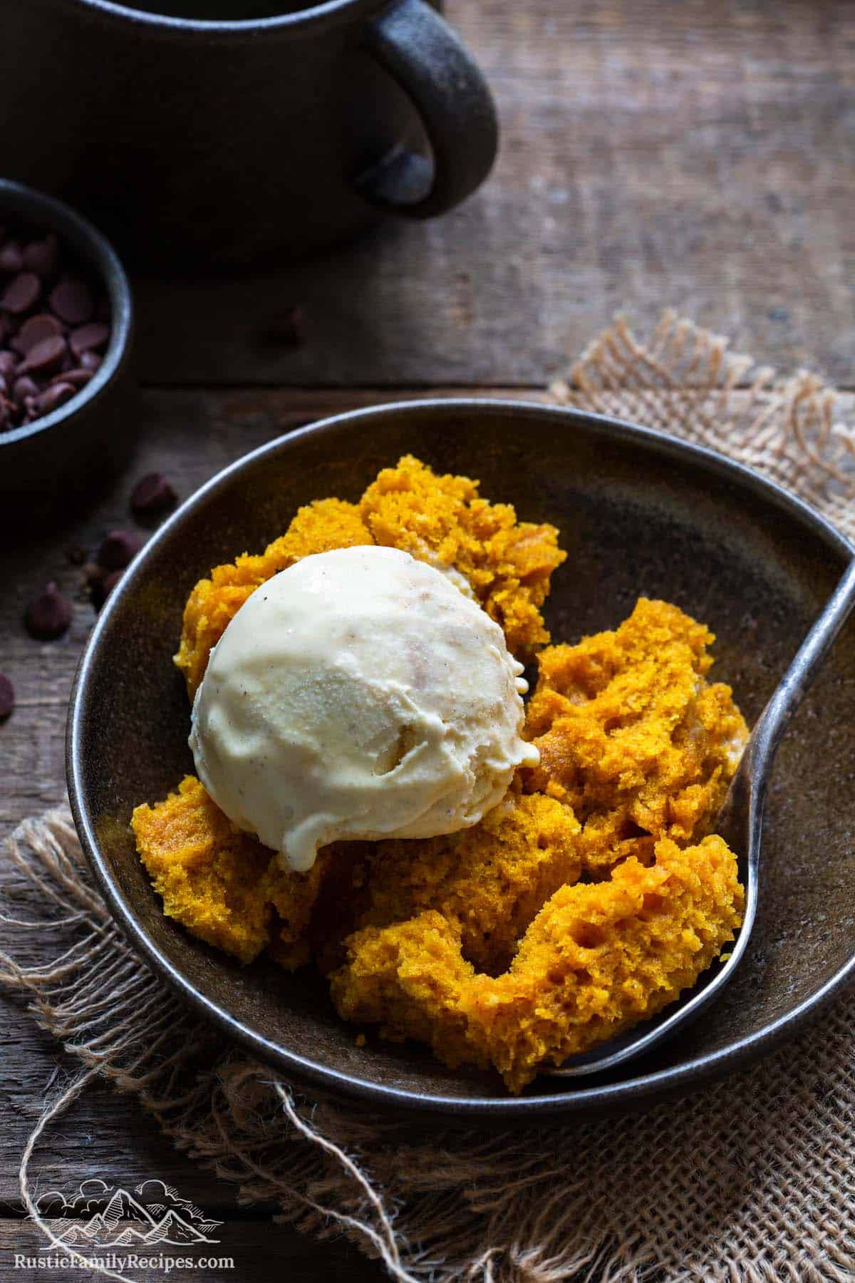 Pumpkin cake in a bowl with ice cream