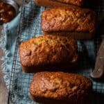 Mini apple zucchini breads cooling on a wire wrack