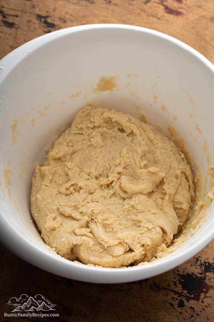 Scone dough in large white mixing bowl