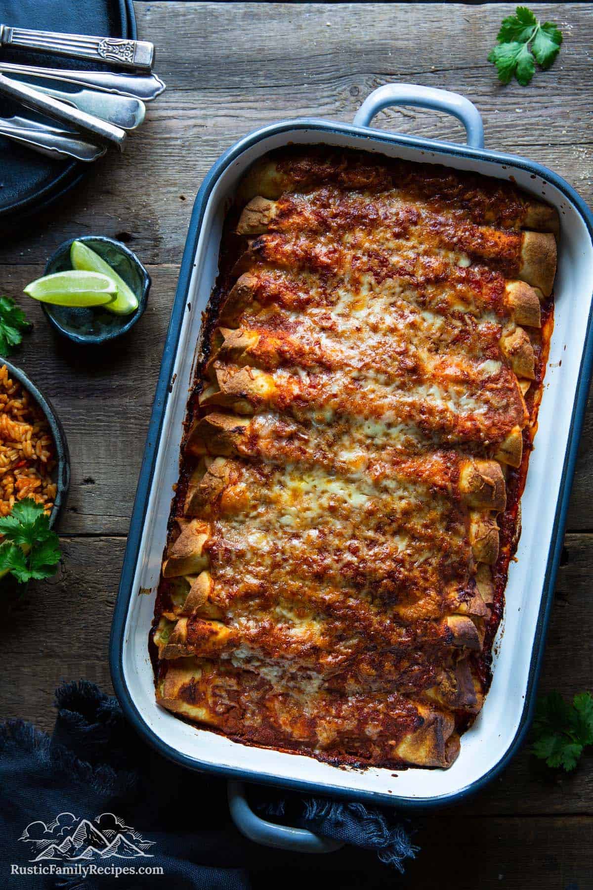 A casserole dish with baked enchiladas