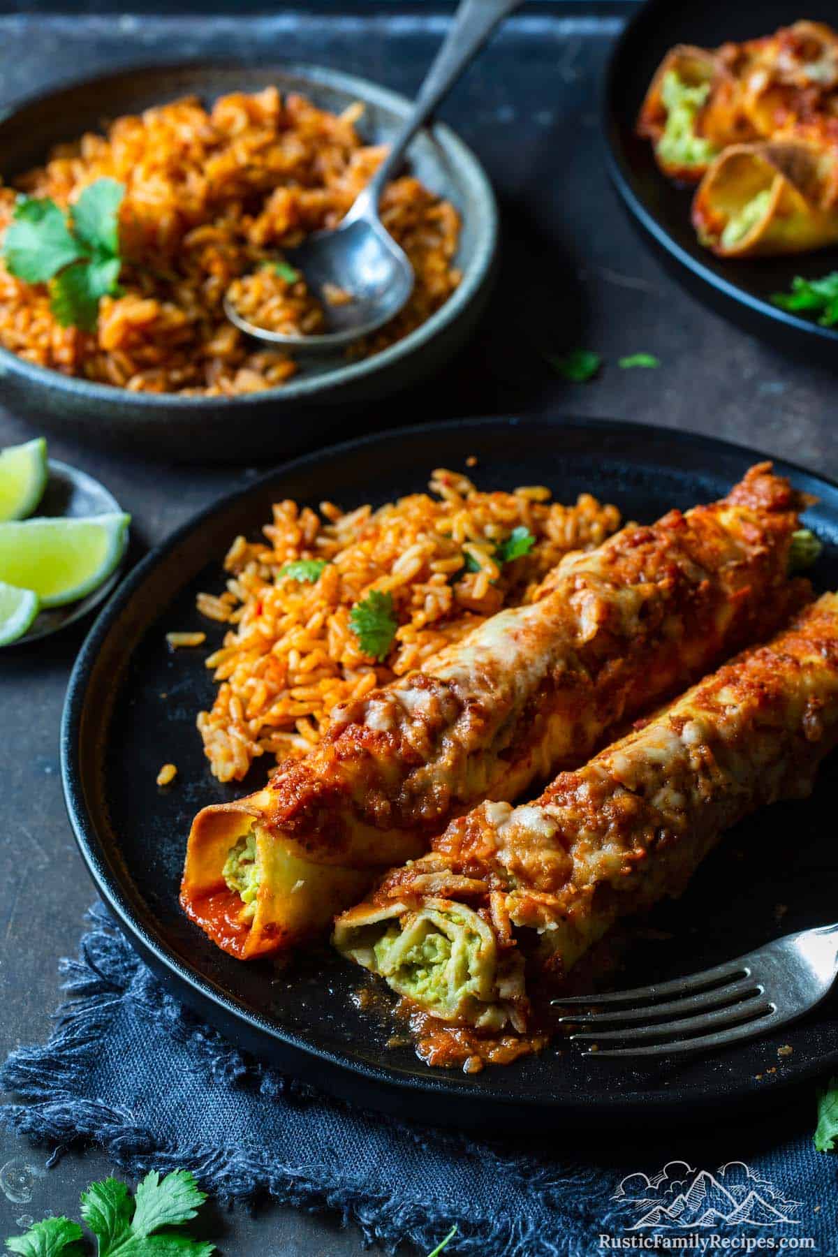 Avocado enchiladas on a plate with mexican rice