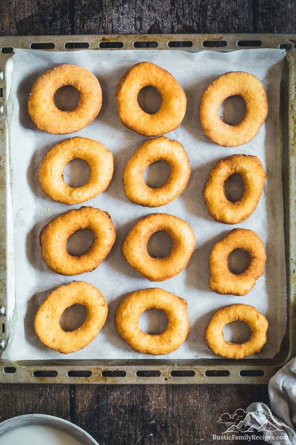 Overhead view of fried, unglazed sour cream donuts