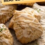 Close up of glazed maple scones on a baking sheet.