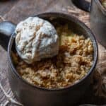 Apple crumble in a mug with ice cream