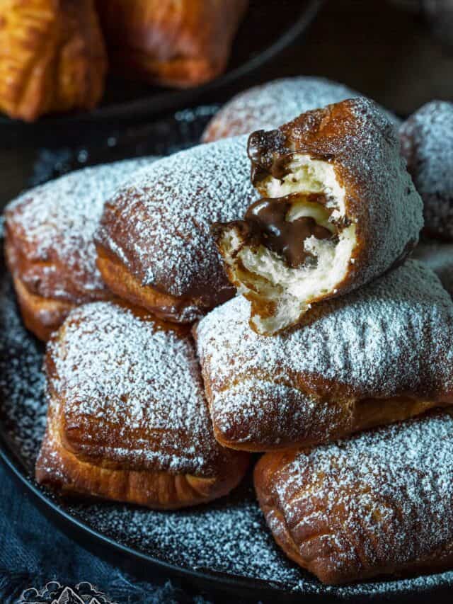 A pile of homemade beignets with nutella