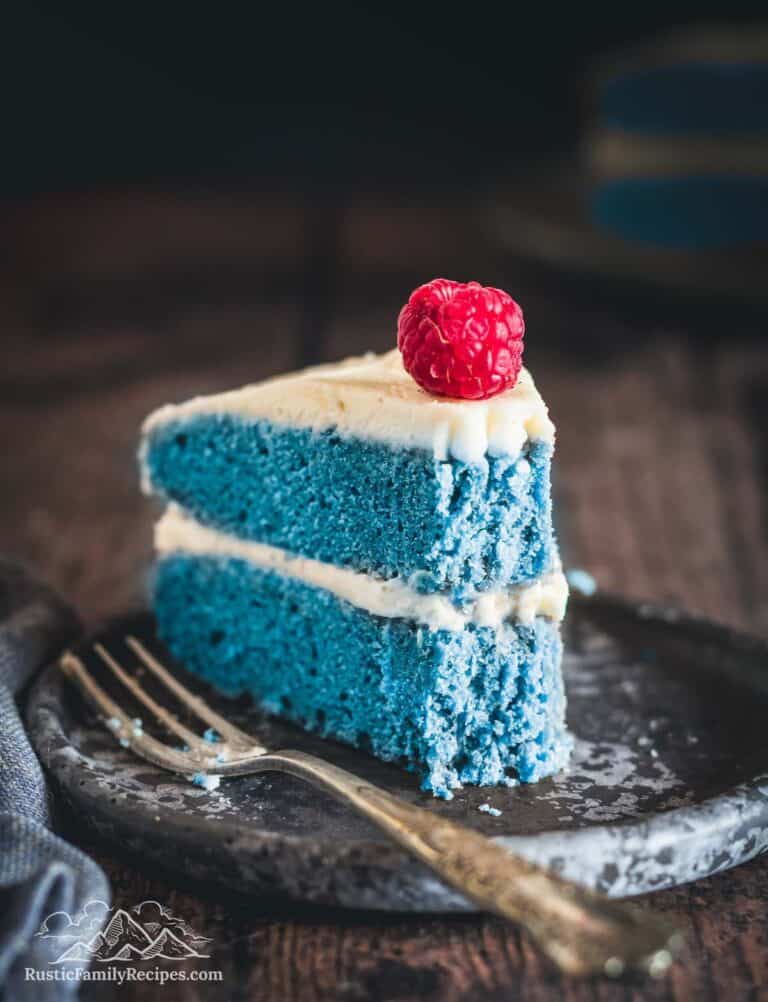 Slice of blue cake with frosting