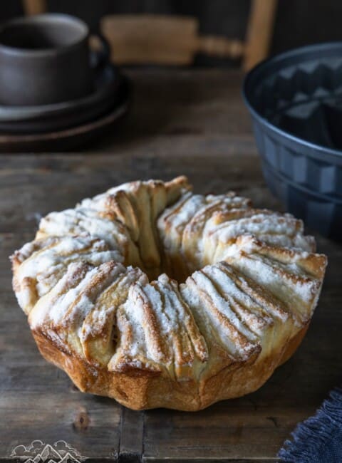 Fluffy Sugared Monkey Bread loaf on a wooden table.