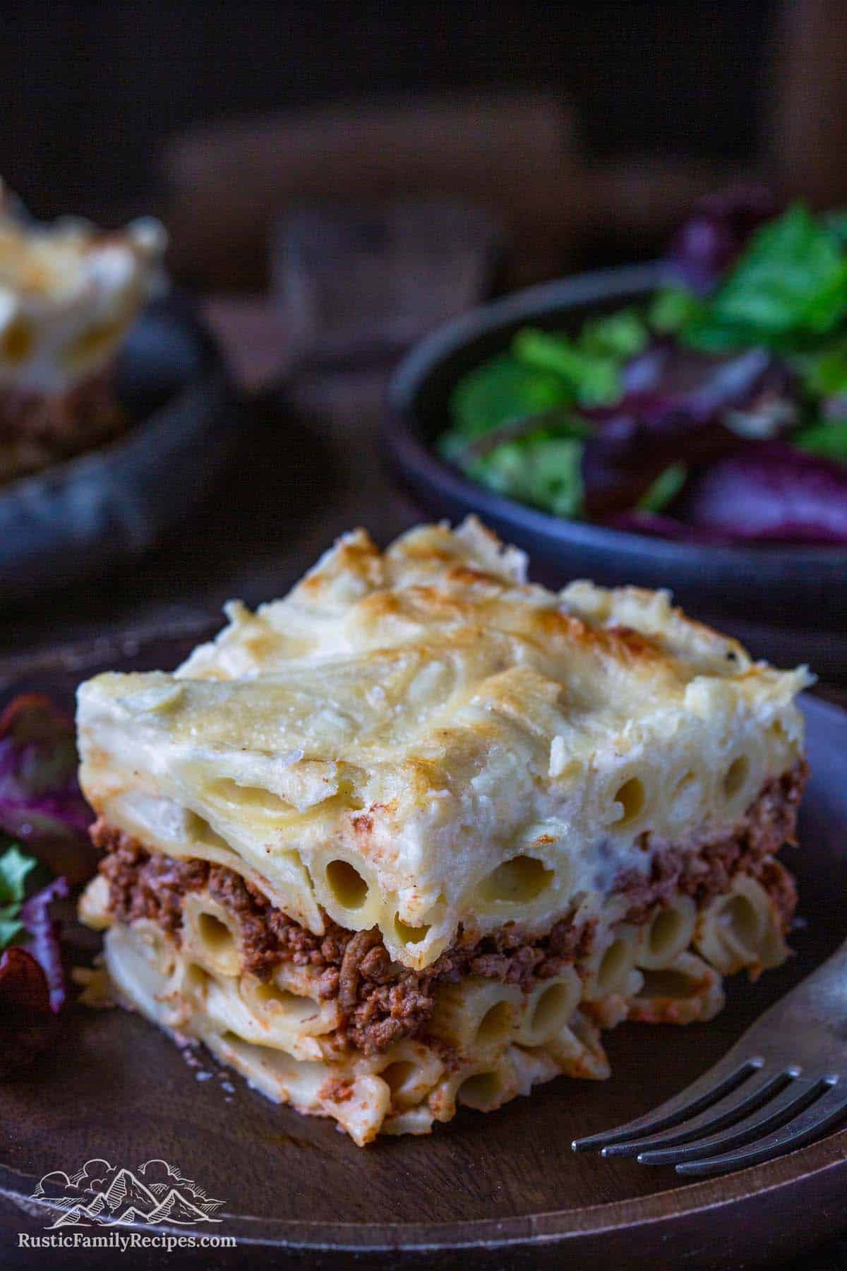 A slice of pastitsio with all its pasta, meat, and béchamel layers.