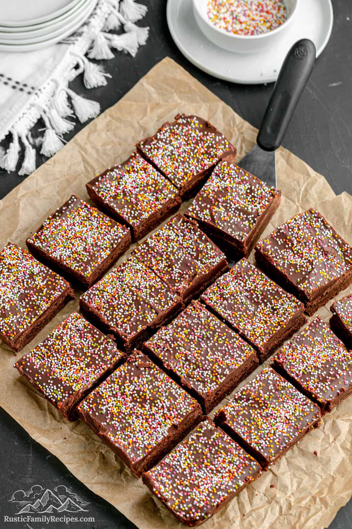 A batch of nearly cosmic brownies on top of a sheet of parchment paper