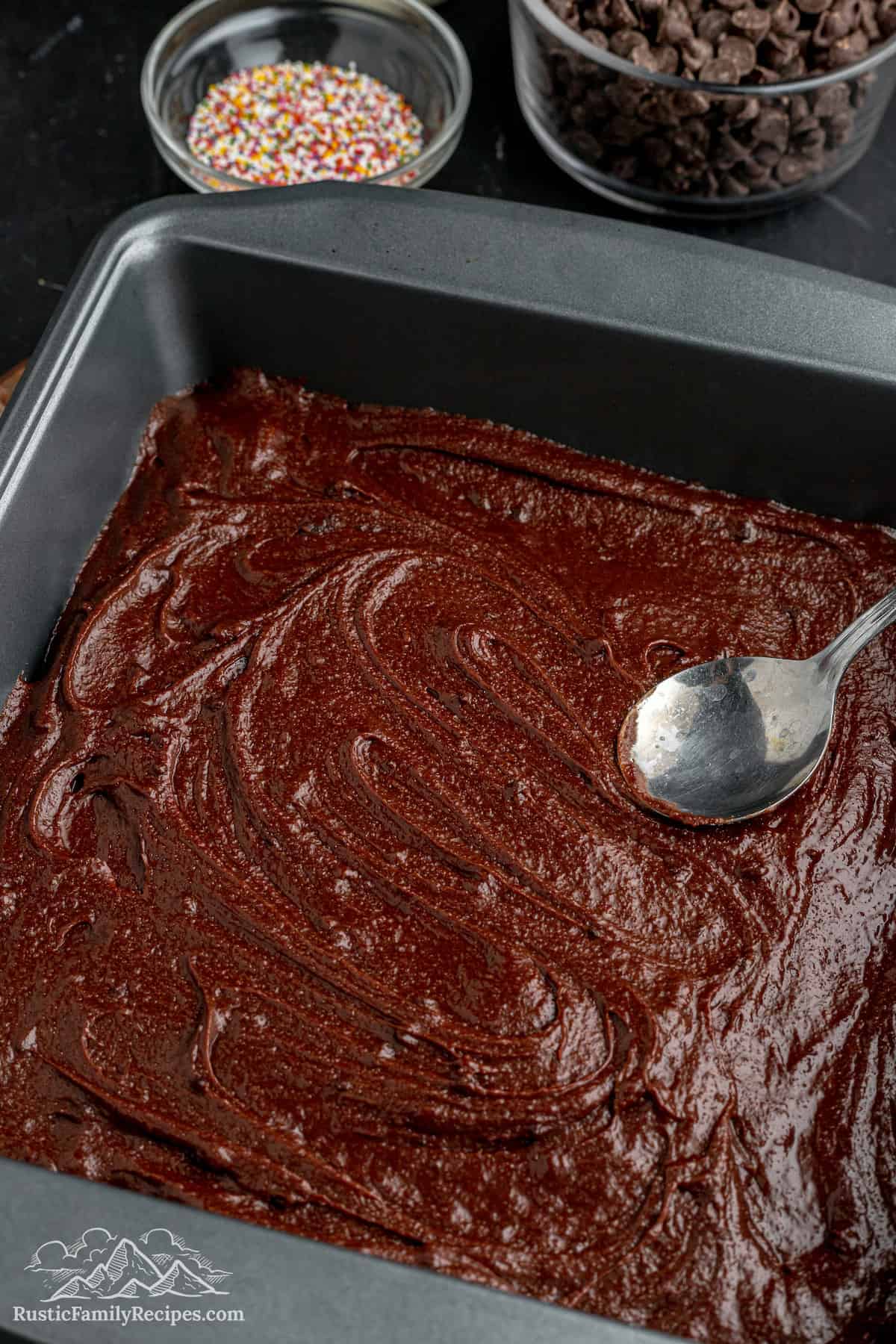 An 8x8-inch baking pan full of brownie batter