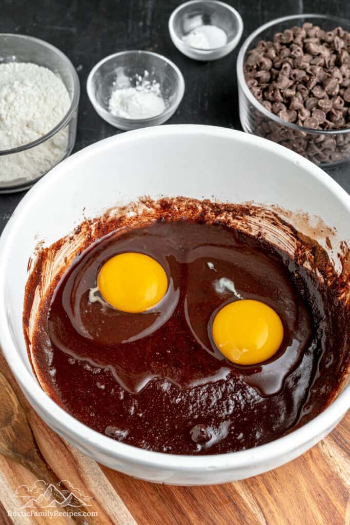 Brownie batter in a mixing bowl right after the eggs have been added