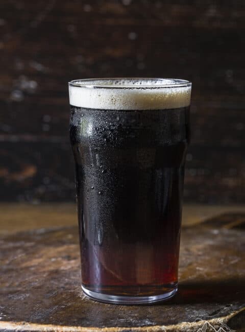 A snakebite drink on a wood table