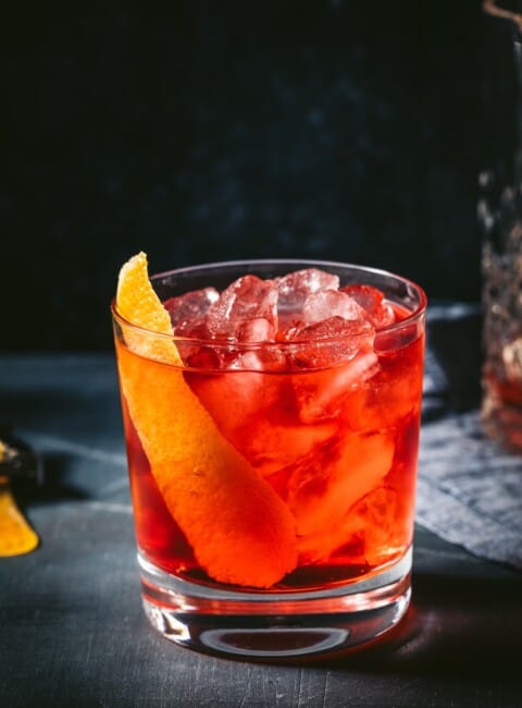 Negroni cocktail in an old fashioned glass with an orange peel