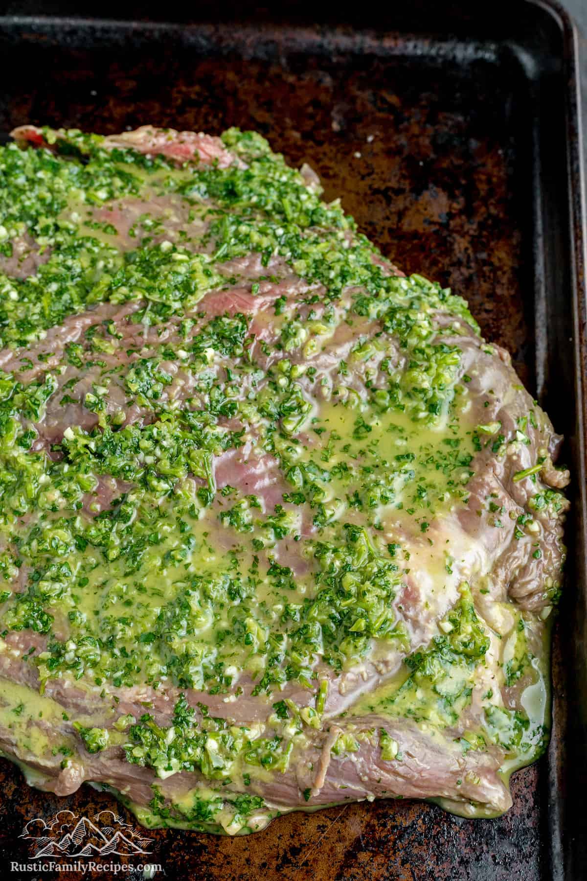 Carne asada steak with marinade ready to be cooked