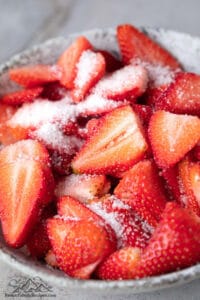 Sliced strawberries with sugar