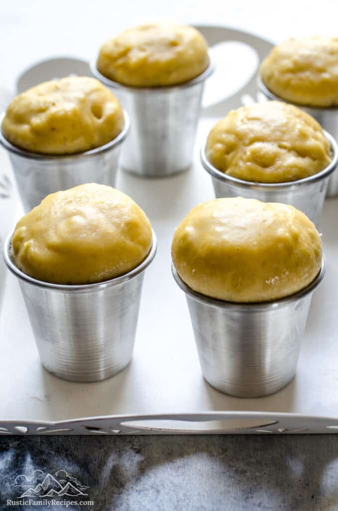 Baba dough risen in the moulds, ready to bake