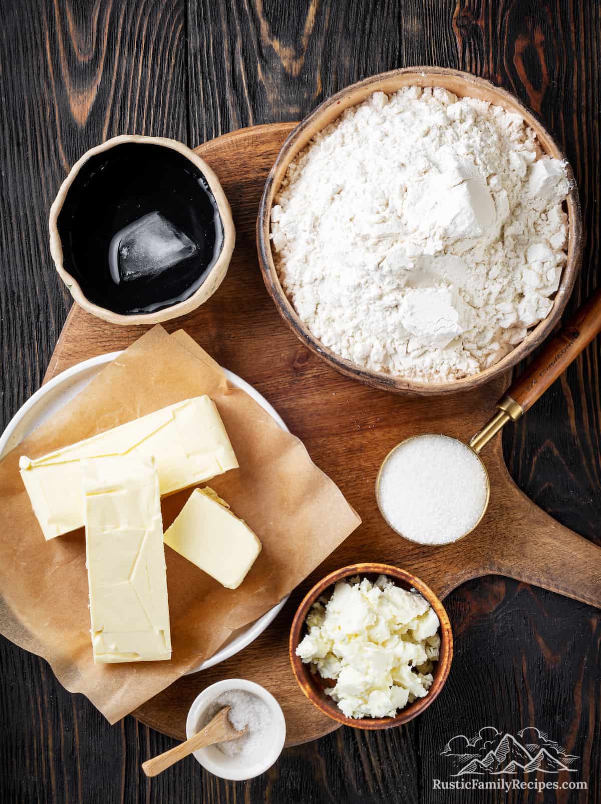 Ingredients for pie crust on a wood table
