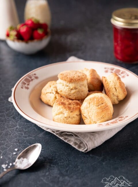 Baking powder shortcake biscuits piled in a white serving bowl.